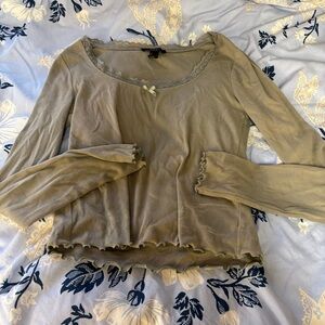 Green long sleeve lettuce trim top with lace neckline and bow